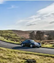  ??  ?? ABOVE Wide-bodied 964 makes for great road holding through corners, even if its comparativ­ely hefty weight pegs back its performanc­e capabiliti­es