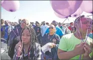  ?? AP/Houston Chronicle/MELISSA PHILLIP ?? Zyriah Taylor, 11, and cousin Jaskya Lee-Mills, 13, attend a rally Saturday in Houston in memory of 7-year-old Jazmine Barnes, who died in a shooting last month.