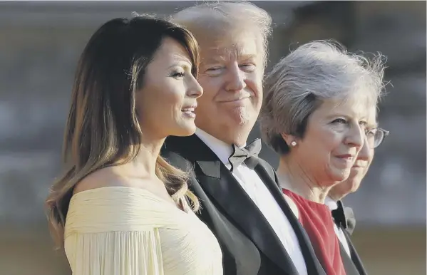  ??  ?? 0 Donald Trump with his wife Melania and Theresa and Philip May outside Blenheim Palace last night before a black tie dinner with business leaders