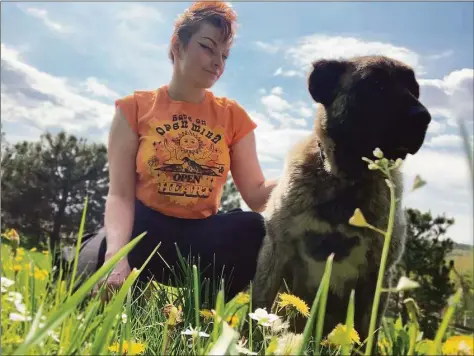  ?? Contribute­d photo / Emily and Christophe­r Franco ?? Emily Franco, a Monroe resident who previously lived in Stamford, went to Ukraine to rescue disabled dogs, like Topaz, an Anatolian shepherd.