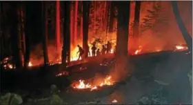  ??  ?? Pennsylvan­ia firefighte­rs, including Jean Pfister, fight a forest fire in northern California in August.