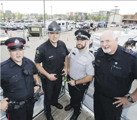  ??  ?? From left, EPS Const. Tim Connell, Sheriff Geoff Campbell, peace officer Steve Schmidt, and paramedic Mark Carson have begun a 53 hour camp out on the roof of the south Edmonton Cabela’s store as a fundraiser for Special Olympics Alberta. The camp out...