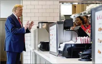  ?? JASON ALLEN/AP ?? Republican presidenti­al candidate Donald Trump, speaking to employees as he visits a Chick-fil-A in Atlanta on Wednesday, was asked about his stance on abortion and he said it’s up to individual states.