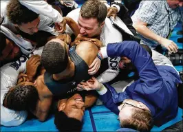  ?? ANDY LYONS / GETTY IMAGES ?? Nevada players celebrate after their 32-8 run to close out the second half Sunday propelled them past Cincinnati and into the Sweet 16.