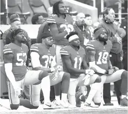  ?? Marcio Jose Sanchez/Associated Press file photo ?? ■ San Francisco 49ers outside linebacker Eli Harold, from bottom left, kneels with safety Eric Reid, wide receiver Marquise Goodwin and wide receiver Louis Murphy during the national anthem before an NFL game on Dec. 24, 2017, against the Jacksonvil­le...