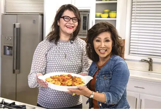  ?? ASHLEE REZIN/ SUN- TIMES PHOTOS ?? Linda Yu and Chef Ursula Adduci in the Chicago Sun- Times kitchen.