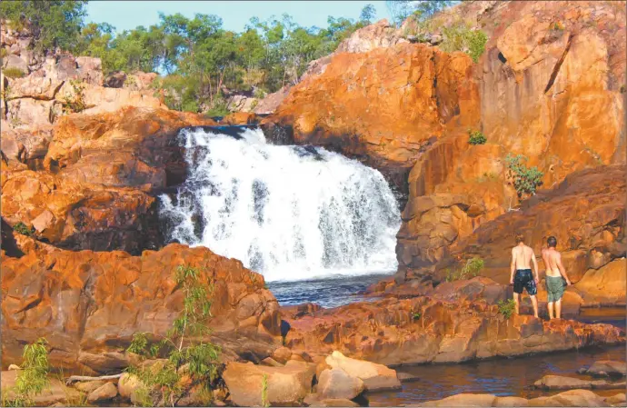  ??  ?? Tourists enjoy a dip in the cooling waters of Leliyn, formerly known as Edith Falls, NT. The pool is considered safe from saltwater crocodiles although the relatively safe freshie is seen in its waters. Photos: AAP Image/caroline Berdon