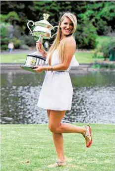  ??  ?? Victoria Azarenka plans to hold many more Grand Slam trophies in the future.
EPA