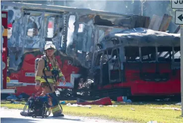  ?? THE ASSOCIATED PRESS ?? Wakulla County first responders work on the scene of an accident on Saturday in Wakulla, Fla. The Florida Highway Patrol said a bus and tractor-trailer collided on a highway in the Panhandle. Florida Highway Patrol Capt. Jeffrey Bissainthe said the bus...