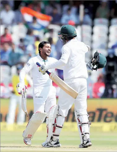  ?? AP ?? Mushfiqur Rahim celebrates after reaching the three-figure mark on Day 4 of the Test against India in Hyderabad.