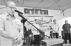  ??  ?? Riot leads a minute of silence in memory of Sarawak’s much-loved former chief minister Datuk Patinggi Tan Sri Adenan Satem who died of heart failure on Jan 11. Seen from left are Othman, Raymond, Peter and Siti Maimunah.