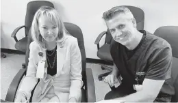  ?? BRIAN BREHM/AP ?? Blue Ridge Hospice President and CEO Cheryl Hamilton Fried and Chief Medical Officer Brendan Flynn review the nonprofit’s 2020 annual report last week in Winchester. October is National Hospice and Palliative Care Month.