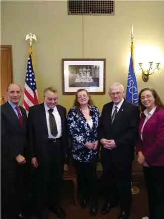  ?? ?? NCBA Wisconsin dealer-members Andy Kimmel and Michelle Voecks-Griesbach, alongside NCBA Concerned Collectors Coalition member Clifford Mishler and industry issues advisor Patrick Heller, stand united with Senator Rachael Cabral-Guevara in support of the historic legislatio­n for a sales-tax exemption on precious-metal bullion.