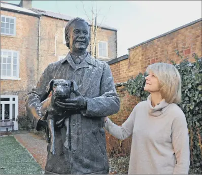  ?? PICTURE: TONY JOHNSON. ?? ANIMAL MAGIC: Dr Rosie Page, a retired Thirsk GP, and the daughter of vet Alf Wight, next to his statue.