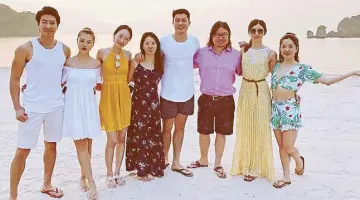  ??  ?? Kevin Kwan with the cast of the feature film adaptation of Crazy Rich Asians: “The reports about who’s playing who, they’re actually jumbled up!”
