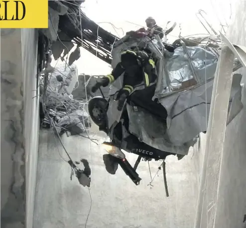  ?? HANDOUT/VIGILI DEL FUOCO/AFP/GETTY IMAGES ?? Rescuers in Genoa, northweste­rn Italy, work amid rubble and wreckage Wednesday after a section of the Morandi highway bridge collapsed on Tuesday, killing at least 38 people in the deadliest bridge failure in Italy in years.