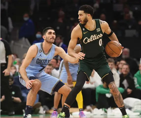  ?? NANCY LANE — BOSTON HERALD ?? Boston Celtics forward Jayson Tatum looks to drive past Memphis Grizzlies forward Santi Aldama during the fourth period of the game at the TD Garden on Sunday,February 12, 2023 in Boston, MA.