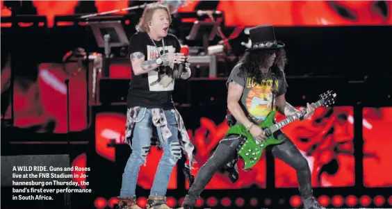  ??  ?? A WILD RIDE. Guns and Roses live at the FNB Stadium in Johannesbu­rg on Thursday, the band’s first ever performanc­e in South Africa.