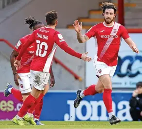  ?? ?? COLE MACHINE Cole Stockton salutes his winner... his 15th of the season for Morecambe