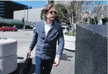  ?? ALEX GALLARDO / THE ASSOCIATED PRESS ?? William H. Macy arrives at a federal courthouse in Los Angeles on Tuesday after his wife Felicity Huffman was charged with conspiracy to commit fraud.