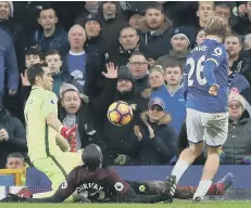  ??  ?? Youngster Tom Davies nets Everton’s third goal