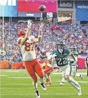  ?? KIRBY LEE/ USA TODAY SPORTS ?? Tight end Travis Kelce scores the Chiefs’ first touchdown on an 18- yard reception in the first quarter Sunday of Super Bowl 57.