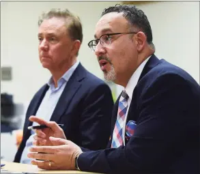  ?? Erik Trautmann / Hearst Connecticu­t Media ?? Education State Department of Education Commission­er Miguel Cardona and Governor Ned Lamont listen to a presentati­on on the dual language curriculum as they visit Silvermine Dual Language Magnet School Friday, February 28, 2020, to celebrate Read Across America at the school in Norwalk, Conn..