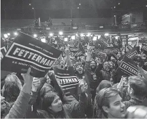  ?? ANGELA WEISS/ AFP VIA GETTY IMAGES ?? Supporters of Pennsylvan­ia Democratic Senate candidate John Fetterman celebrate at a watch party during the midterm elections at Stage AE in Pittsburgh on Tuesday.