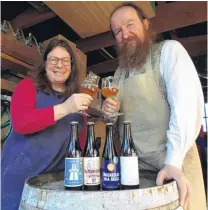  ?? PHOTO: DANIEL BIRCHFIELD ?? Cheers . . . LeeAnn Scotti and Michael O’Brien, of Oamaru’s Craftwork Brewery, raise a glass to celebrate the four medals it won at the recent Australian Internatio­nal Beer Awards.