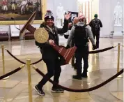  ?? WIN MCNAMEE Getty Images ?? A mob enters the Capitol onWednesda­y in Washington, D.C.
