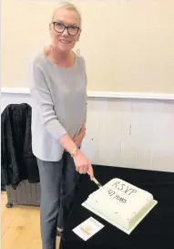  ??  ?? Slice of history Oonagh Aitken cuts celebratio­n cake