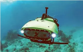  ?? QUEENSLAND UNIVERSITY OF TECHNOLOGY ?? A newly developed robot makes a world-first baby coral delivery to the Great Barrier Reef.