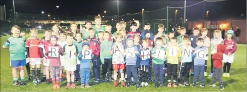  ?? ?? Young Galtee Gaels footballer­s observe a minute’s silence at Mitchelsto­wn Leisure Centre on Tuesday, January 18 as a mark of respect for Ashling Murphy RIP.