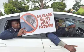  ??  ?? Demonstrat­ors make their way to the Zimbabwean State House. AFP/GETTY IMAGES