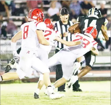  ??  ?? Oak Hill Academy’s Camden Payne (23) makes a hit on defense, while Connor Freeman (8) closes in to assist during last week’s game at Canton Academy. (Photo by Liz Bryan, for DTL)