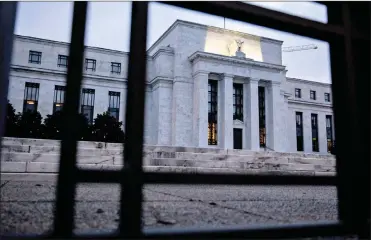  ?? PHOTO: BLOOMBERG ?? The Marriner S Eccles Federal Reserve Board building in Washington, DC. Federal Reserve officials left US interest rates unchanged last month and stuck with a plan to gradually lift borrowing costs amid strong growth that backs bets for a hike next month.