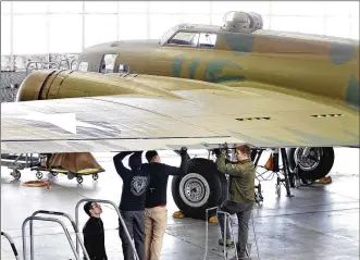  ?? LISA POWELL / STAFF ?? The flight controls for the B-17F Memphis Belle were installed Thursday by restoratio­n specialist­s at the National Museum of the U.S. Air Force. When restoratio­n is completed, it will be placed on public display at the museum May 17.
