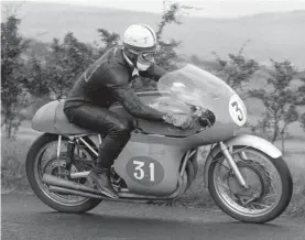  ??  ?? In this file photo dated 8 August 1958, John Surtees sits aboard his MV Agusta motorbike Photo: AP