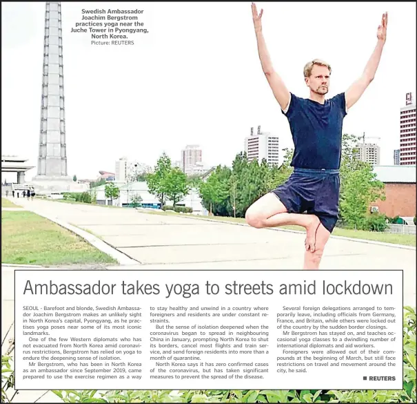  ?? Picture: REUTERS ?? Swedish Ambassador Joachim Bergstrom practices yoga near the Juche Tower in Pyongyang, North Korea.