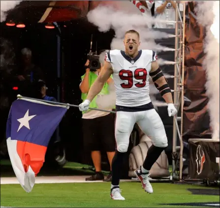  ??  ?? Houston Texans defensive end J.J. Watt (99) is introduced to the crowd prior to an NFL football game against the Jacksonvil­le Jaguars on Sunday in Houston. AP PHOTO