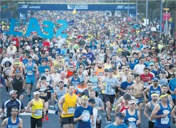  ?? Patrick T. Fallon For The Times ?? RUNNERS at the starting line of the L.A. Marathon at Dodger Stadium on Sunday morning. The race, which doubles as a festive city celebratio­n, included 24,000 runners and was expected to draw 500,000 spectators.