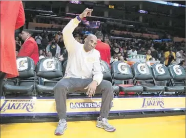  ?? Robert Gauthier ?? THE 37-YEAR-OLD superstar waves to fans during warm-ups. The crowd gave him a standing ovation during introducti­ons, then roared when he took his first shot — a 40-footer that clanked off the back of the rim.