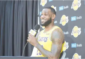  ?? — AFP photo ?? LeBron James addresses the media for the first time since his blockbuste­r move to the Los Angeles Lakers.