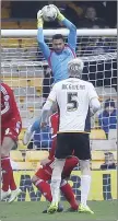  ??  ?? MY BALL: Swindon keeper Wes Foderingha­m gathers