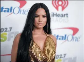  ?? PHOTO BY RICHARD SHOTWELL — INVISION — AP, FILE ?? In this file photo, Demi Lovato arrives at Jingle Ball at The Forum in Inglewood Lovato celebrated six years sober at a concert in New York with tour mate and DJ Khaled, whose powerful brought the pop star to tears. Lovato performed Friday at the...