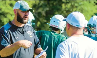  ?? APRIL GAMIZ/THE MORNING CALL ?? Allentown Central Catholic High School coach Tim McGorry calls for adjustment­s during practice Aug. 9 in Allentown.