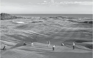  ?? SUBMITTED PHOTO ?? Golfers are pictured on the ninth green at The Links of Crowbush Cove. Former P.E.I. Liberal MLA Paul Connolly credits fomer federal cabinet minister John Crosbie, who died Friday, with paving the way for the championsh­ip golf course, which opened in 1993 in Lakeside.