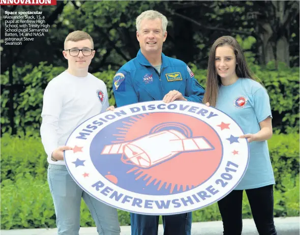  ??  ?? Space spectacula­r Alexander Slack, 15, a pupil at Renfrew High School, with Trinity High School pupil Samantha Batten, 14, and NASA astronaut Steve Swanson