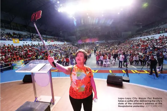  ??  ?? Lapu-Lapu City Mayor Paz Radaza takes a selfie after delivering the city’s state of the children’s address at the Hoopsdome yesterday. JOY TORREJOS