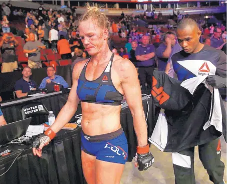  ?? NAM Y. HUH/ASSOCIATED PRESS ?? Holly Holm leaves the octagon after her loss to Valentina Shevchenko in their UFC bout in Chicago on Saturday night.